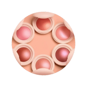 plusieurs fards à joues cote à cote en forme de cercle sur fond rose pastel